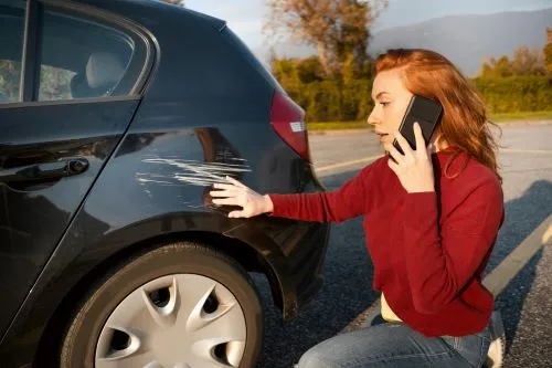 A woman calls to report a car accident.